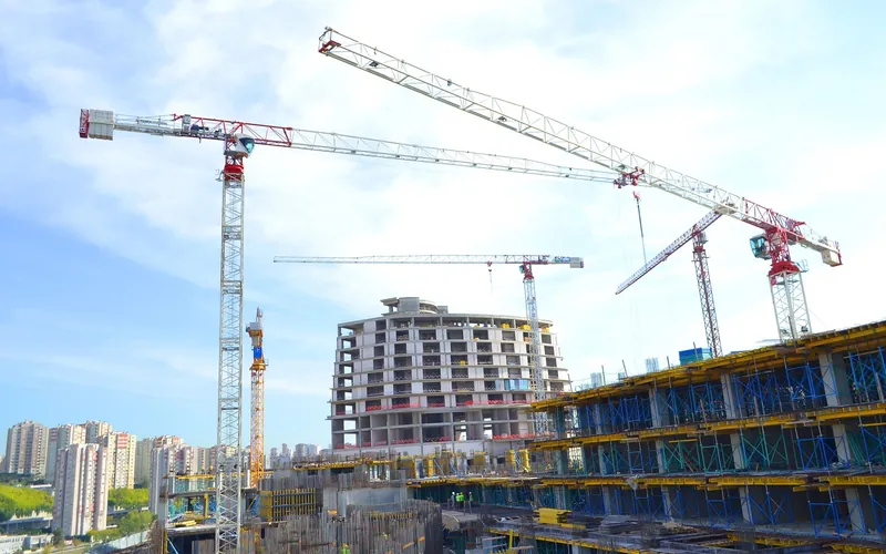 A tower crane over a building under construction
